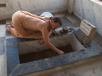 Cleaning Rupa Goswami Foot bathing area